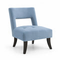 Poltrona in velluto blu con gambe in legno